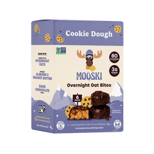 Front view of Mooski Cookie Dough Overnight Oat Bites 6-pack box showcasing chocolate-dipped oat bites and 80 calories / 3g sugar labels on purple and cream packaging