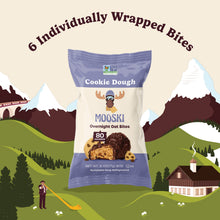 Front view of Mooski Cookie Dough Bites bag showing 80-calorie badge and 6 individually wrapped banner on mountain backdrop